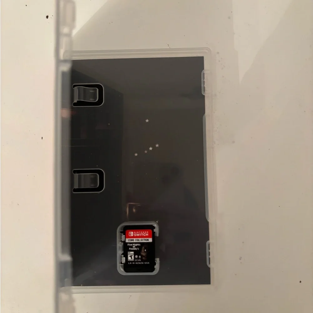 Nintendo Switch with Vibrant Purple and Yellow Joy-Con free games